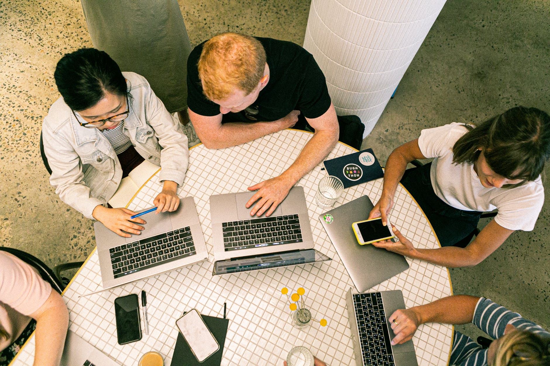 aerial view of people in a meeting with yellowish background tone